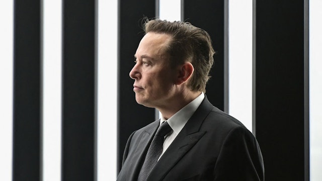 Tesla CEO Elon Musk is pictured as he attends the start of the production at Tesla's "Gigafactory" on March 22, 2022 in Gruenheide, southeast of Berlin. - US electric car pioneer Tesla received the go-ahead for its "gigafactory" in Germany on March 4, 2022, paving the way for production to begin shortly after an approval process dogged by delays and setbacks. (Photo by Patrick Pleul / POOL / AFP) (Photo by PATRICK PLEUL/POOL/AFP via Getty Images)