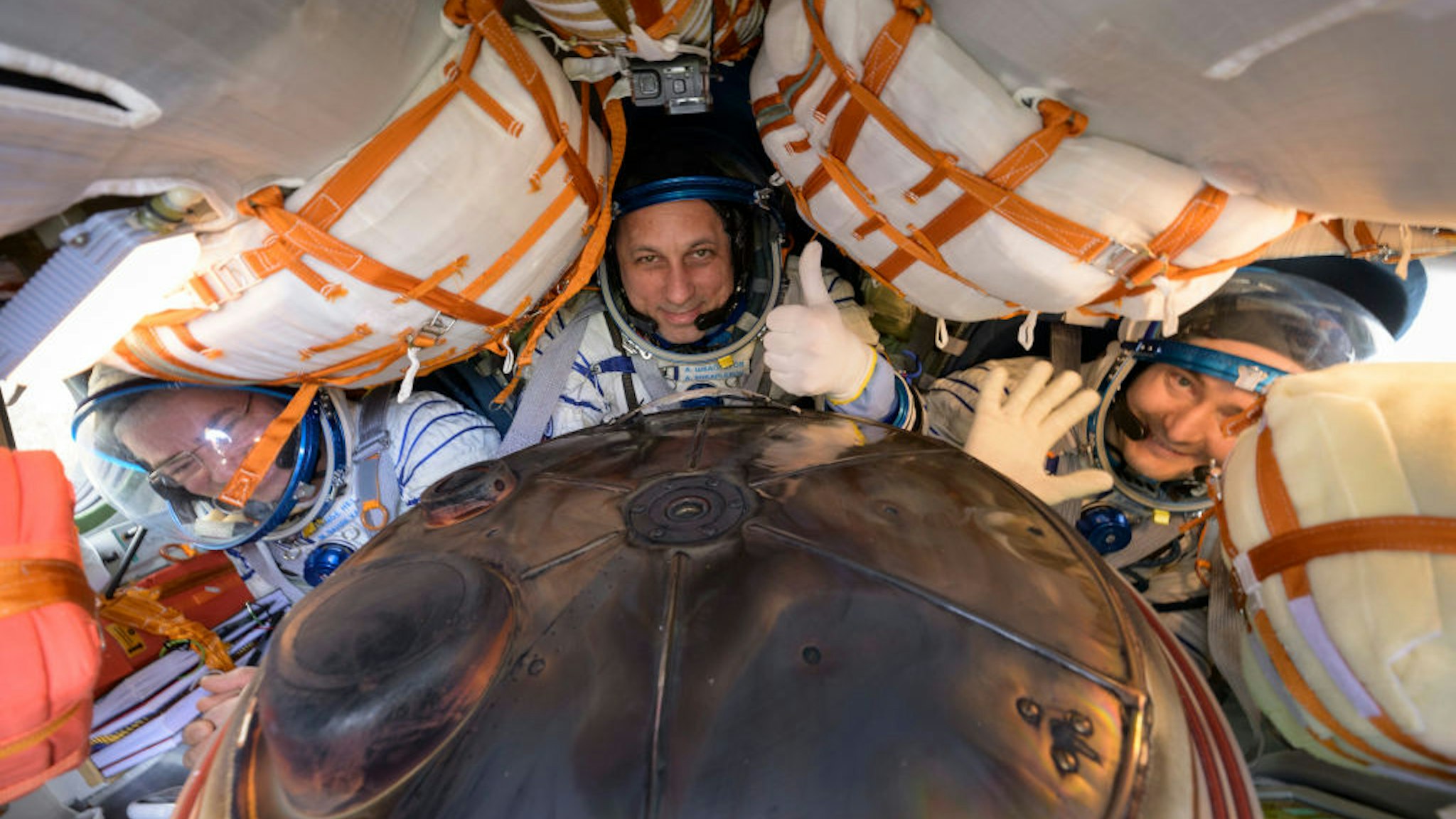 In this handout image provided by the U.S. National Aeronatics and Space Administration (NASA), Expedition 66 crew members (L-R) Mark Vande Hei of NASA, cosmonauts Anton Shkaplerov and Pyotr Dubrov of Roscosmos, are seen inside their Soyuz MS-19 spacecraft after is landed in a remote area near the town of Zhezkazgan on March 30, 2022 in Zhezkazgan, Kazakhstan.