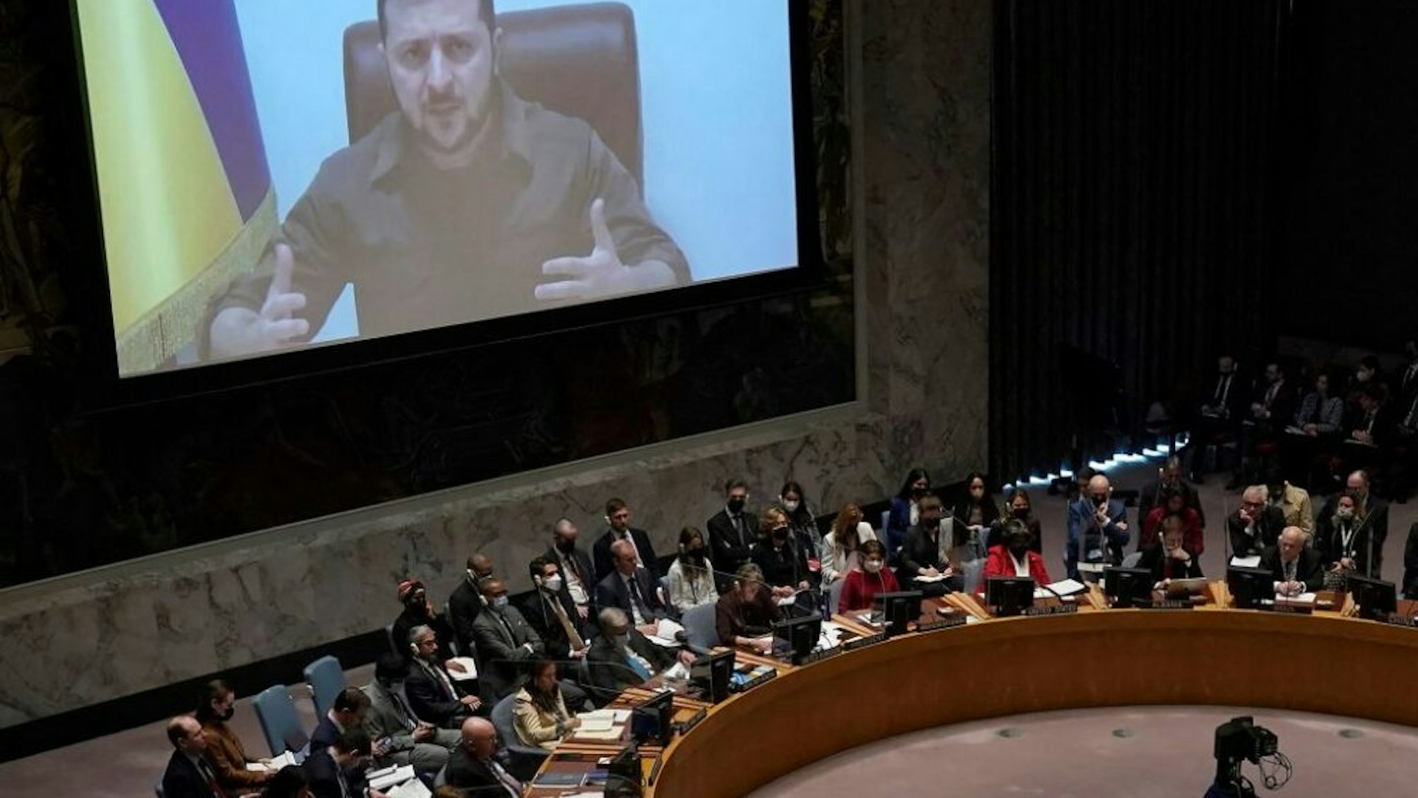 President Volodymyr Zelensky, of Ukraine, addresses a meeting of the United Nations Security Council in New York City on April 5, 2022. - Zelensky challenged the United Nations to "act immediately" or "dissolve yourself altogether" during a blistering address in which he showed a harrowing video of dead bodies -- including children -- he said were victims of Russian atrocities.