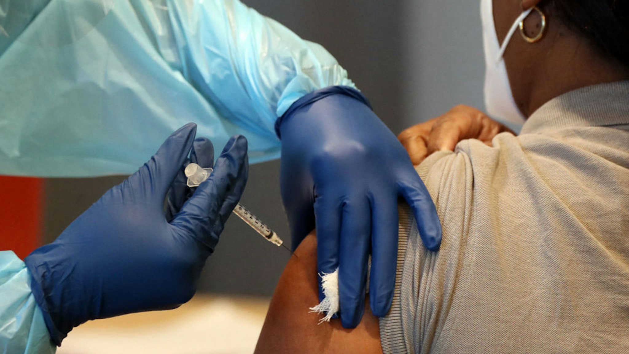 A woman receives the COVID-19 vaccine in this file photo. (Amy Beth Bennett/Sun Sentinel/Tribune News Service via Getty Images)