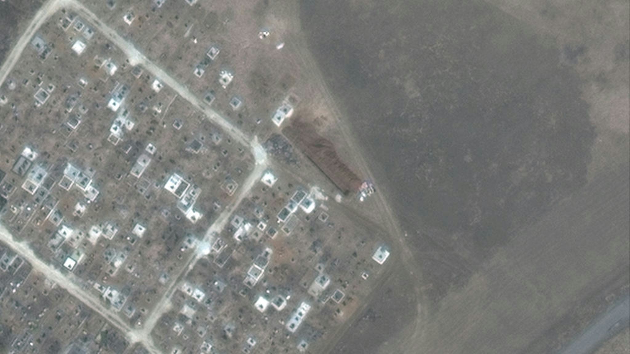 Maxar satellite imagery of another mass grave site expansion just outside of Vynohradne, Ukraine -- just east of Mariupol. Sequence -- 4 of 4 images.