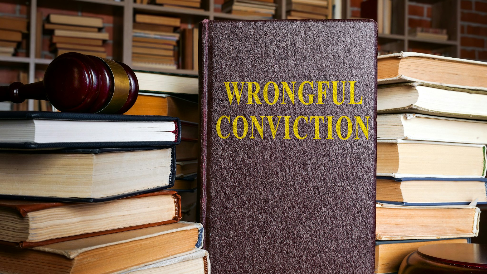 The book about Wrongful conviction and gavel. - stock photo
