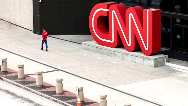 ATLANTA, GEORGIA - MARCH 15: People walk by the world headquarters for CNN on March 15, 2022 in Atlanta, Georgia. Last month CNN's president Jeff Zucker resigned over a consensual, but unreported, relationship with a colleague. Television producer Chris Licht will become the company's new president in April. (Photo by Anna Moneymaker/Getty Images)