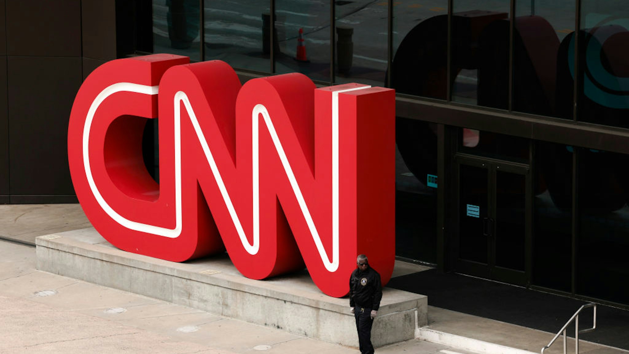 ATLANTA, GEORGIA - MARCH 15: People walk by the world headquarters for the Cable News Network (CNN) on March 15, 2022 in Atlanta, Georgia. Last month CNN's president Jeff Zucker resigned over a consensual, but unreported, relationship with a colleague. Television producer Chris Licht will become the company's new president in April. (Photo by Anna Moneymaker/Getty Images)