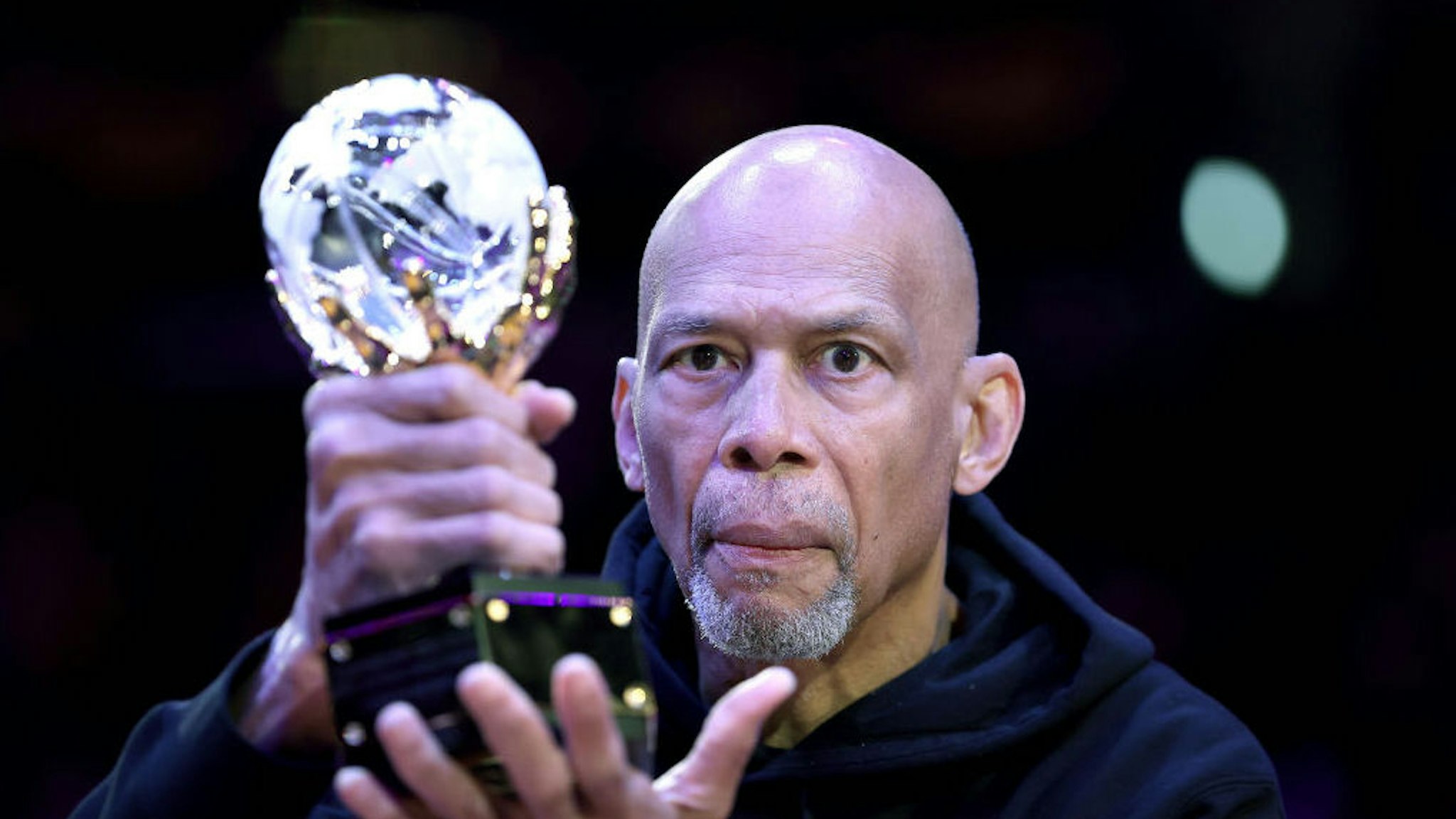 LOS ANGELES, CALIFORNIA - APRIL 03: Retired basketball player Kareem Abdul-Jabbar holds the trophy for the league’s annual Social Justice Champion award prior to a game between the Los Angeles Lakers and the Denver Nuggets at Crypto.com Arena on April 03, 2022 in Los Angeles, California. NOTE TO USER: User expressly acknowledges and agrees that, by downloading and/or using this Photograph, user is consenting to the terms and conditions of the Getty Images License Agreement. Mandatory Copyright Notice: Copyright 2022 NBAE (Photo by Sean M. Haffey/Getty Images)