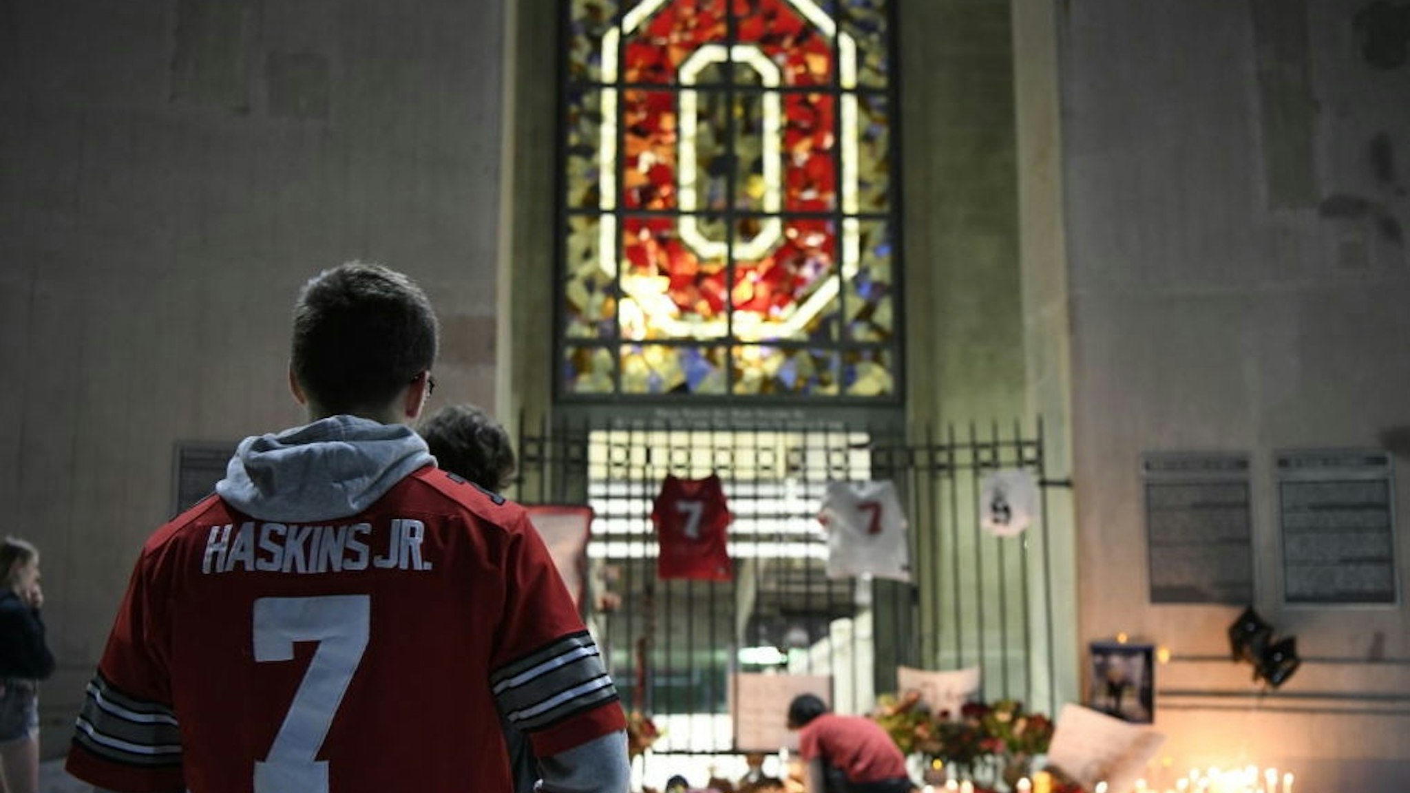 COLUMBUS, OHIO - APRIL 12: Fans and students hold a candlelight vigil at Ohio Stadium in memory of Dwayne Haskins on April 12, 2022 in Columbus, Ohio. Pittsburgh Steelers quarterback and former Ohio State Buckeye Dwayne Haskins, 24, died Saturday morning after he was struck by a dump truck while walking on a South Florida highway. (Photo by Gaelen Morse/Getty Images)