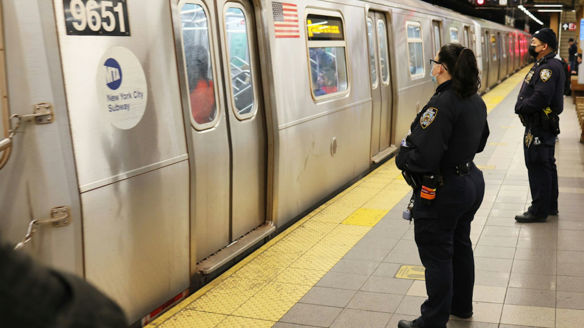 NYPD officers patrol the subway platform at the 36 Street subway station on April 13, 2022 in the Sunset Park neighborhood of Brooklyn in New York City.