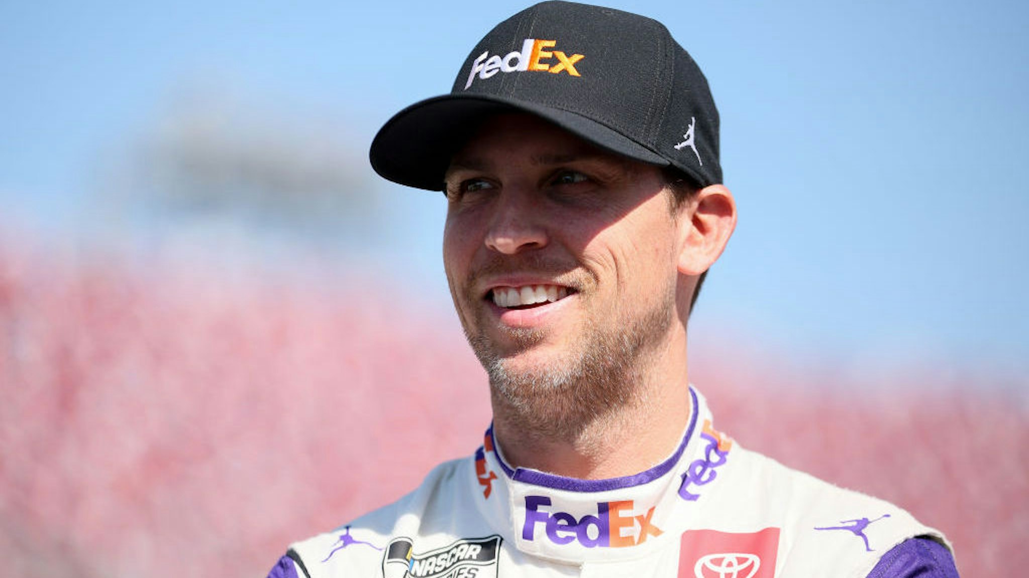 TALLADEGA, ALABAMA - APRIL 23: Denny Hamlin, driver of the #11 FedEx All in for Small Business Toyota, waits on the grid during qualifying for the NASCAR Cup Series GEICO 500 at Talladega Superspeedway on April 23, 2022 in Talladega, Alabama. (Photo by James Gilbert/Getty Images)
