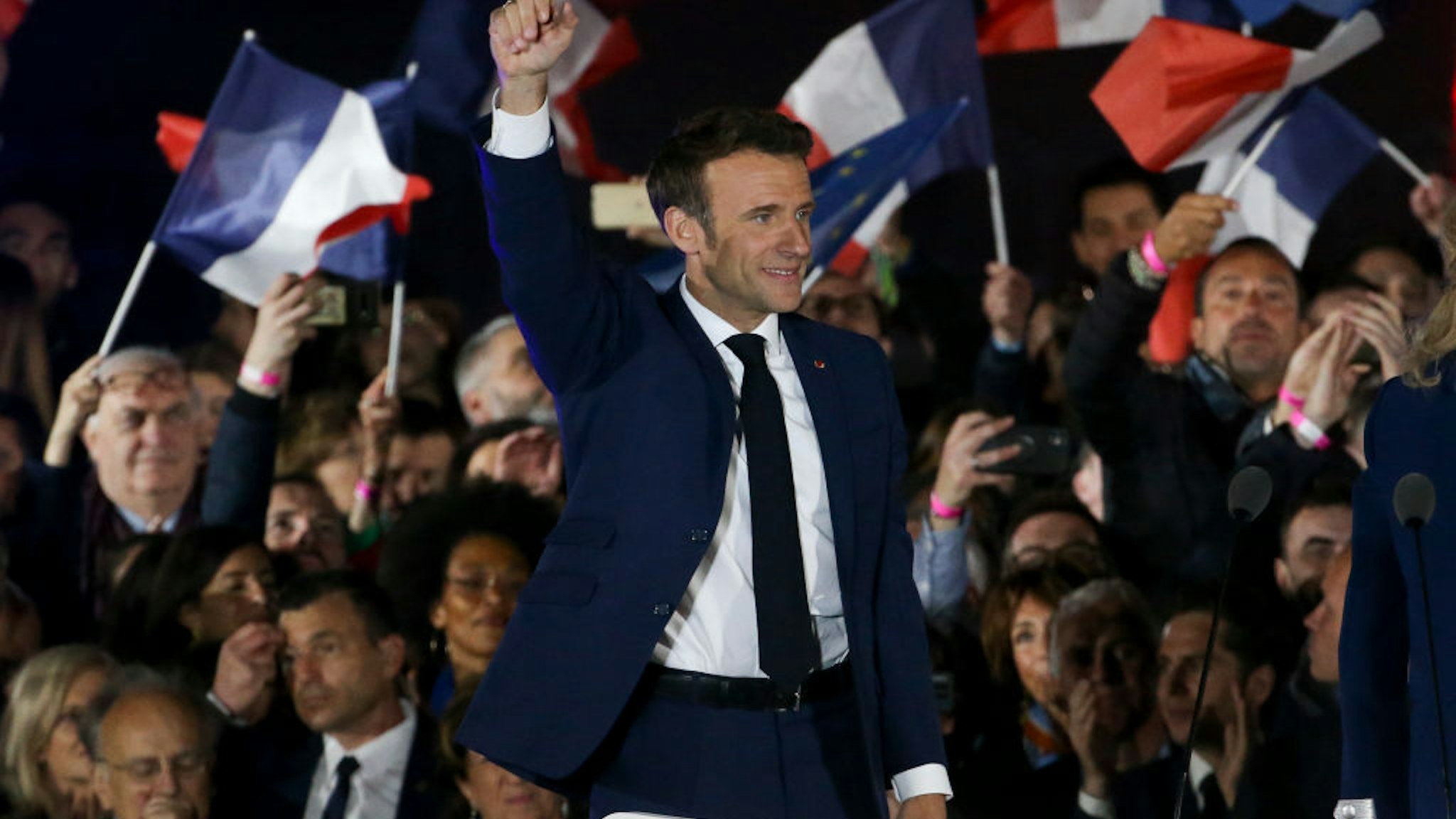 PARIS, FRANCE - APRIL 24: French President Emmanuel Macron celebrates his re-election at the Champ de Mars near the Eiffel Tower on April 24, 2022 in Paris, France. France's centrist incumbent President Emmanuel Macron beats his far-right rival Marine Le Pen in the presidential second round for a second five-year term as President. (Photo by Jean Catuffe/Getty Images)