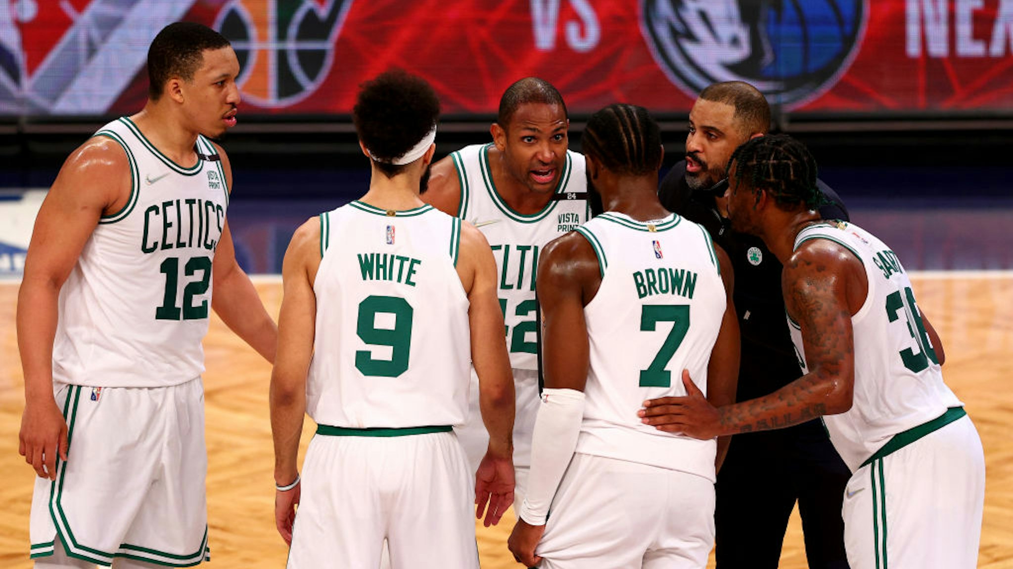 NEW YORK, NEW YORK - APRIL 25: Grant Williams #12,Derrick White #9,Al Horford #42, Jaylen Brown #7, Marcus Smart #36 and head coach Ime Udoka of the Boston Celtics huddle in the final minutes during Game Four of the Eastern Conference First Round Playoffs against the Boston Celtics at Barclays Center on April 25, 2022 in the Brooklyn borough of New York City. The Boston Celtics defeated the Brooklyn Nets 116-112. NOTE TO USER: User expressly acknowledges and agrees that, by downloading and or using this photograph, User is consenting to the terms and conditions of the Getty Images License Agreement. (Photo by Elsa/Getty Images)