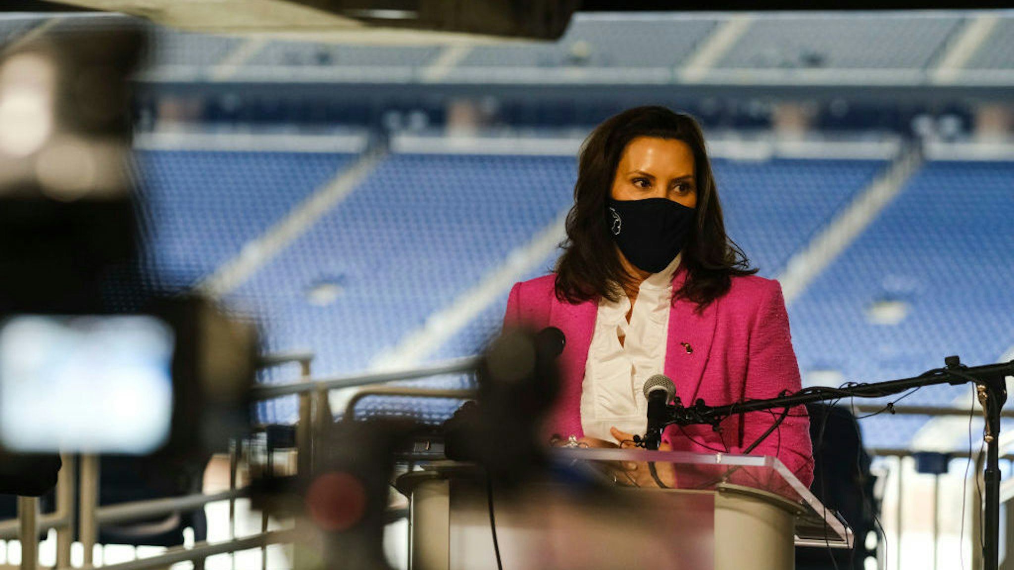DETROIT, MI - APRIL 06: Michigan Governor Gretchen Whitmer speaks to members of the press about the rising numbers of Covid-19 cases in Michigan and the vaccine availability before receiving a dose of the Pfizer Covid vaccine at Ford Field on April 6, 2021 in Detroit, Michigan. As the US reaches a milestone in vaccinations, a surge of new Covid-19 cases has swept through the US with Michigan seeing the highest numbers of new cases. (Photo by Matthew Hatcher/Getty Images)