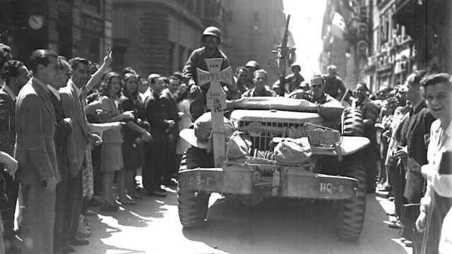 June 4, 1944. Rome, Italy, American soldiers driving down Via del Corso.