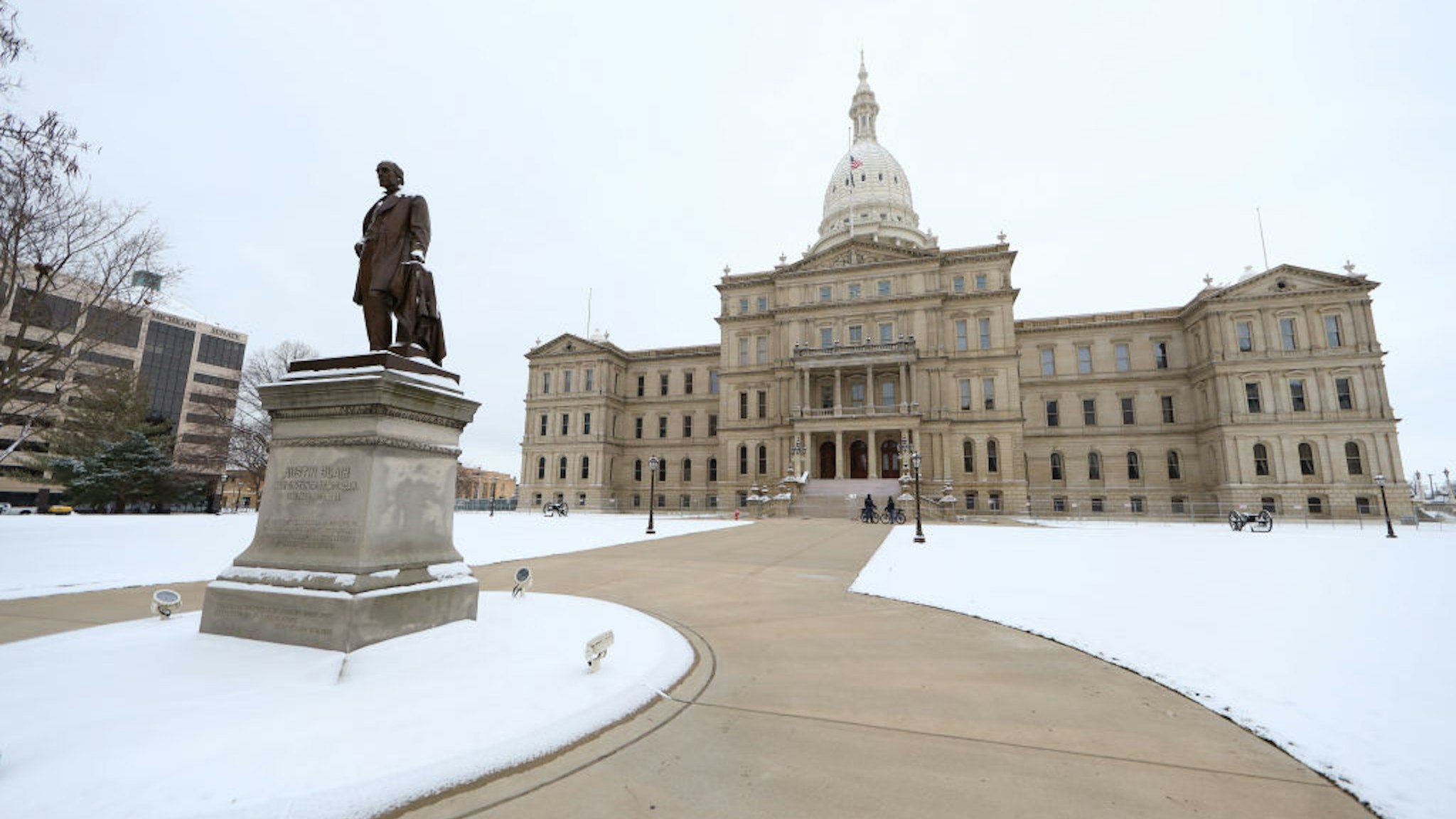 LANSING, MI - JANUARY 20: Michigan state police patrol the grounds outside the Michigan state capitol building on January 20, 2021 in Lansing, Michigan. State capitols across the country have activated National Guard members and police to prepare for demonstrations by right-wing groups, as Joe Biden is sworn in as the 46th president of the United States at today's inauguration ceremony in Washington, DC. (Photo by Rey Del Rio/Getty Images)