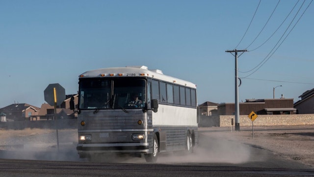 A bus transporting migrants is pictured leaving a temporary facility set up to hold migrants at a United States Border Patrol Station in Clint, Texas, on June 25, 2019