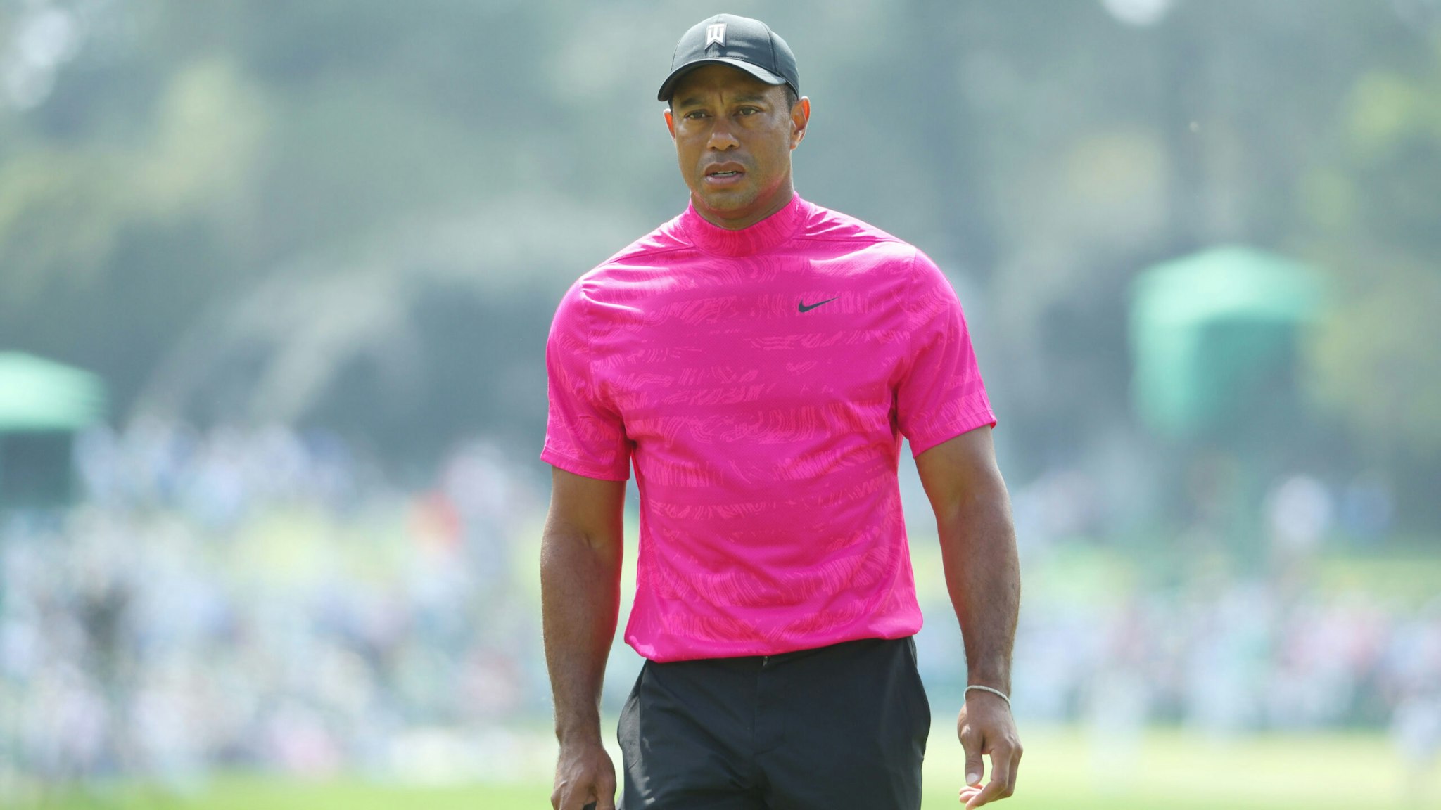 AUGUSTA, GEORGIA - APRIL 07: Tiger Woods lines up a putt on the first green during the first round of the Masters at Augusta National Golf Club on April 07, 2022 in Augusta, Georgia.