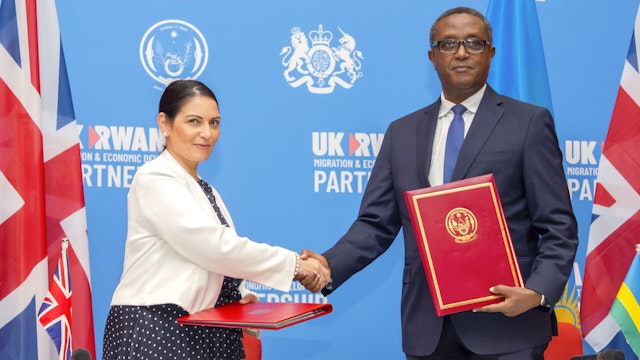KIGALI, RWANDA - APRIL 1: Home Secretary of the United Kingdom Priti Patel (L) and Rwandan Foreign Minister Vincent Biruta (R) sign an agreement on "Migration and Economic Development Partnership Agreement" inn Kigali, Rwanda on April 14, 2022.