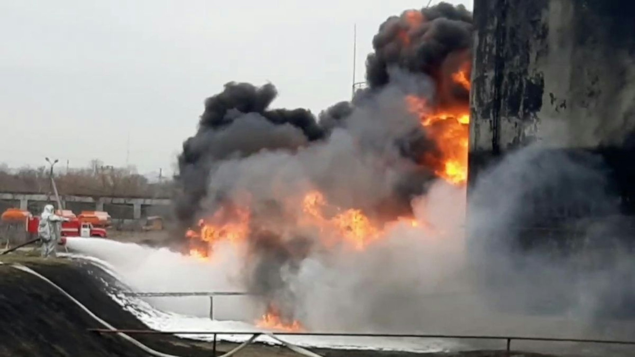 A screen grab captured from a video shows firefighters responding a fire, broke out after Ukranian military helicopters hit a fuel depot in the Russian city of Belgorod, Russiaâs governor of the Belgorod region Vyacheslav Gladkov said, on April 1, 2022.
