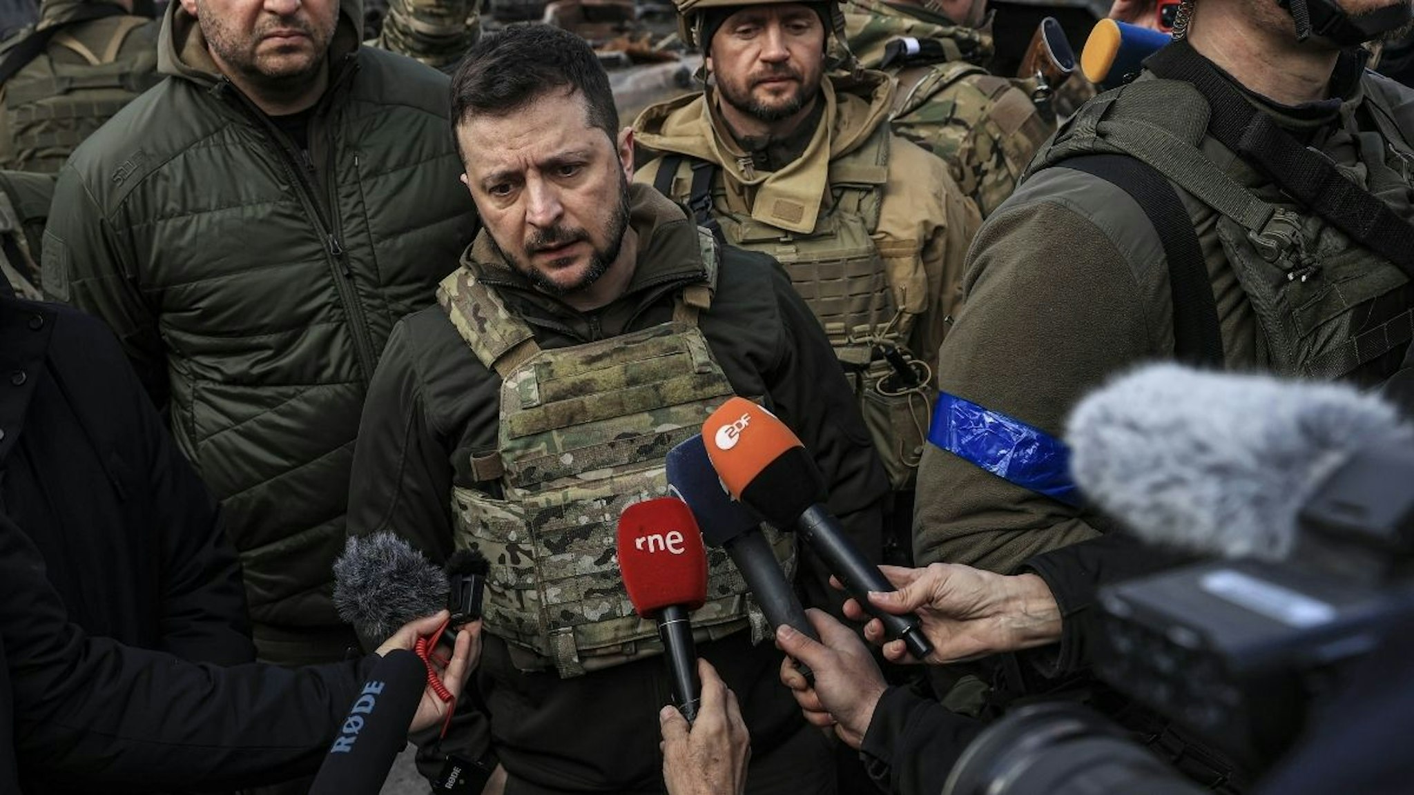 Ukrainian President Volodymyr Zelenskyy accompanied by Ukrainian soldiers speaks to press during his visit at the town of Bucha, after it was liberated from Russian Army, in Bucha, Ukraine on April 04, 2022.