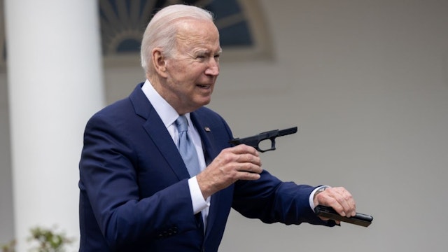 President Joe Biden interacts with a âghost gunâ in the Rose Garden at the White House during an event on gun violence on April 11th, 2022 in Washington, DC, USA.