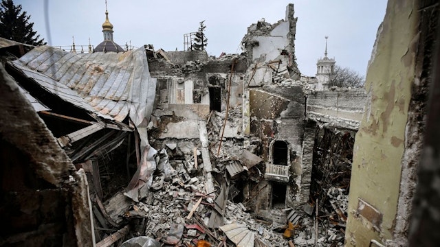 This picture shows the partially destroyed Mariupol drama theatre, bombed last March 16, in Mariupol on April 12, 2022, as Russian troops intensify a campaign to take the strategic port city, part of an anticipated massive onslaught across eastern Ukraine, while Russia's President makes a defiant case for the war on Russia's neighbour.