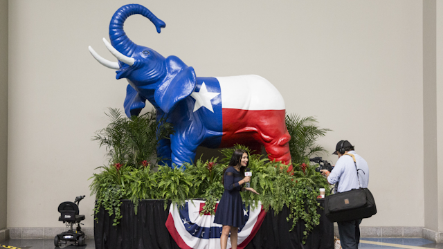 Members of the media film a segment in front of a Texas flag themed elephant statue during the 2016 Texas Republican Convention in Dallas, Texas, U.S., on Saturday, May 14, 2016. Paul Ryan made clear Thursday that he is sticking with his extraordinary gambit that he isn't ready to support the Republican nominee for president unless Donald Trump can demonstrate that he's Republican enough.