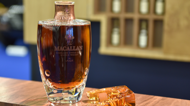LONDON, ENGLAND - OCTOBER 23: A bottle of 55 years old Macallan highland single malt scotch whisky in Lalique is displayed during the RM Sotherb's London, European car collectors event at Olympia London on October 23, 2019 in London, England. RM Sotheby's London, billed as the annual highlight for European car collectors will show Edwardians to modern supercars and offers collectors and attendees the opportunity to experience the very best of European cars. Sotheby’s will also present The Ultimate Whisky Collection, the most valuable collection of whisky ever to be sold at auction, both events will culminate in live auctions on 24th October.