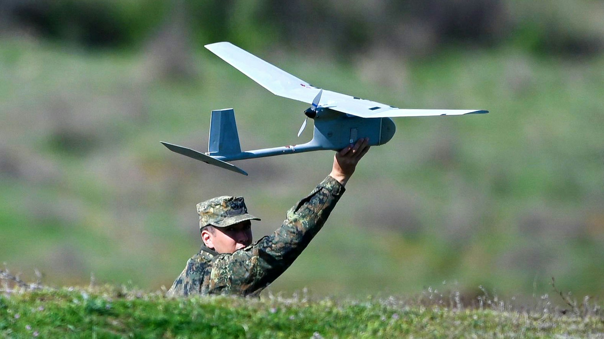 A US army soldier holds a drone during a NATO joint military training exercise with Bulgaria's army at Novo Selo military ground on April 21, 2022.