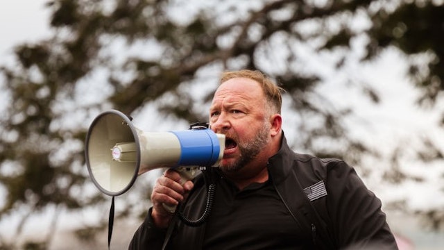 WASHINGTON, DC - JANUARY 06: Alex Jones, the founder of right-wing media group Infowars, addresses a crowd of pro-Trump protesters after they storm the grounds of the Capitol Building on January 6, 2021 in Washington, DC. A pro-Trump mob stormed the Capitol earlier, breaking windows and clashing with police officers. Trump supporters gathered in the nation's capital today to protest the ratification of President-elect Joe Biden's Electoral College victory over President Trump in the 2020 election. (Photo by