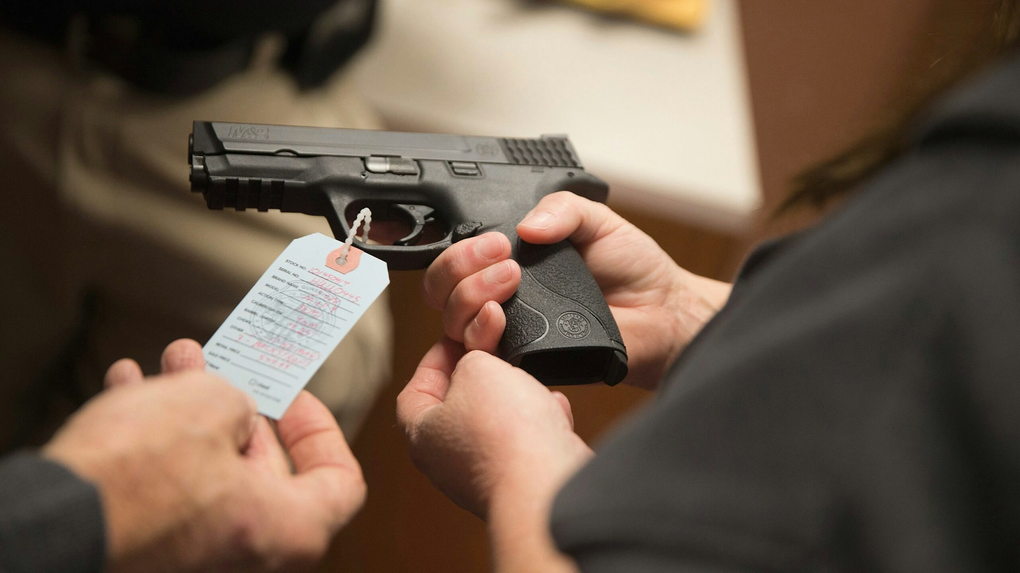 Customers shop for a handgun at Metro Shooting Supplies on November 12, 2014 in Bridgeton, Missouri.