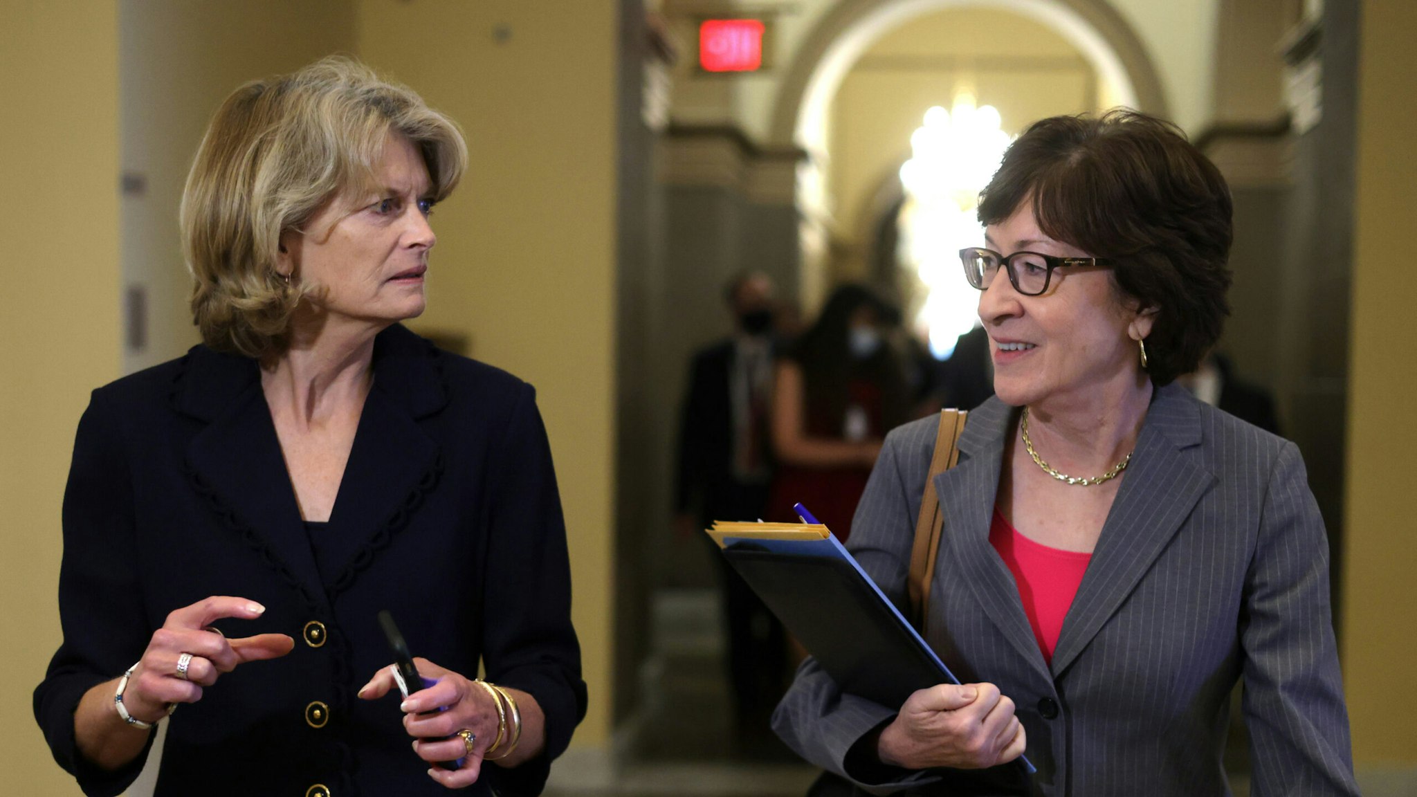 Sens. Lisa Murkowski (R-AK) (L) and Susan Collins (R-ME) leave after a Senate GOP conference meeting at the Capitol October 7, 2021 in Washington, DC.