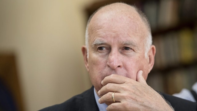California Governor Jerry Brown Interview Jerry Brown, governor of California, watches a presentation during an interview in Sacramento, California, U.S., on Wednesday, May 23, 2018. The legal battle over California's nation-leading auto emissions standards, which U.S. Environmental Protection Agency Administrator Scott Pruitt has threatened to dismantle, may continue throughout President Donald Trump's tenure in office, Brown said. Photographer: David Paul Morris/Bloomberg via Getty Images Bloomberg / Contributor