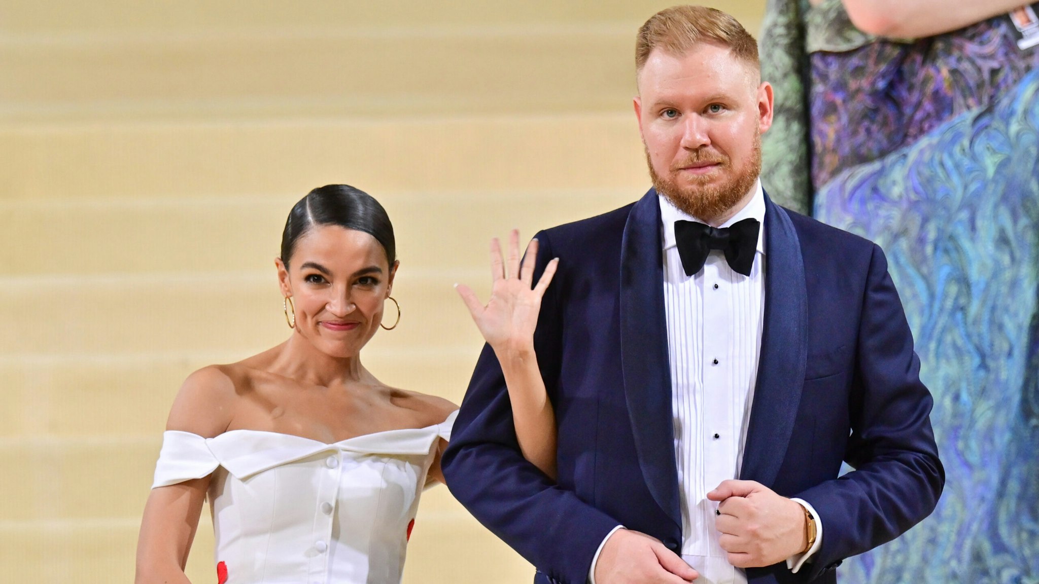 Alexandria Ocasio-Cortez and Riley Roberts leave the 2021 Met Gala Celebrating In America: A Lexicon Of Fashion at Metropolitan Museum of Art on September 13, 2021 in New York City.