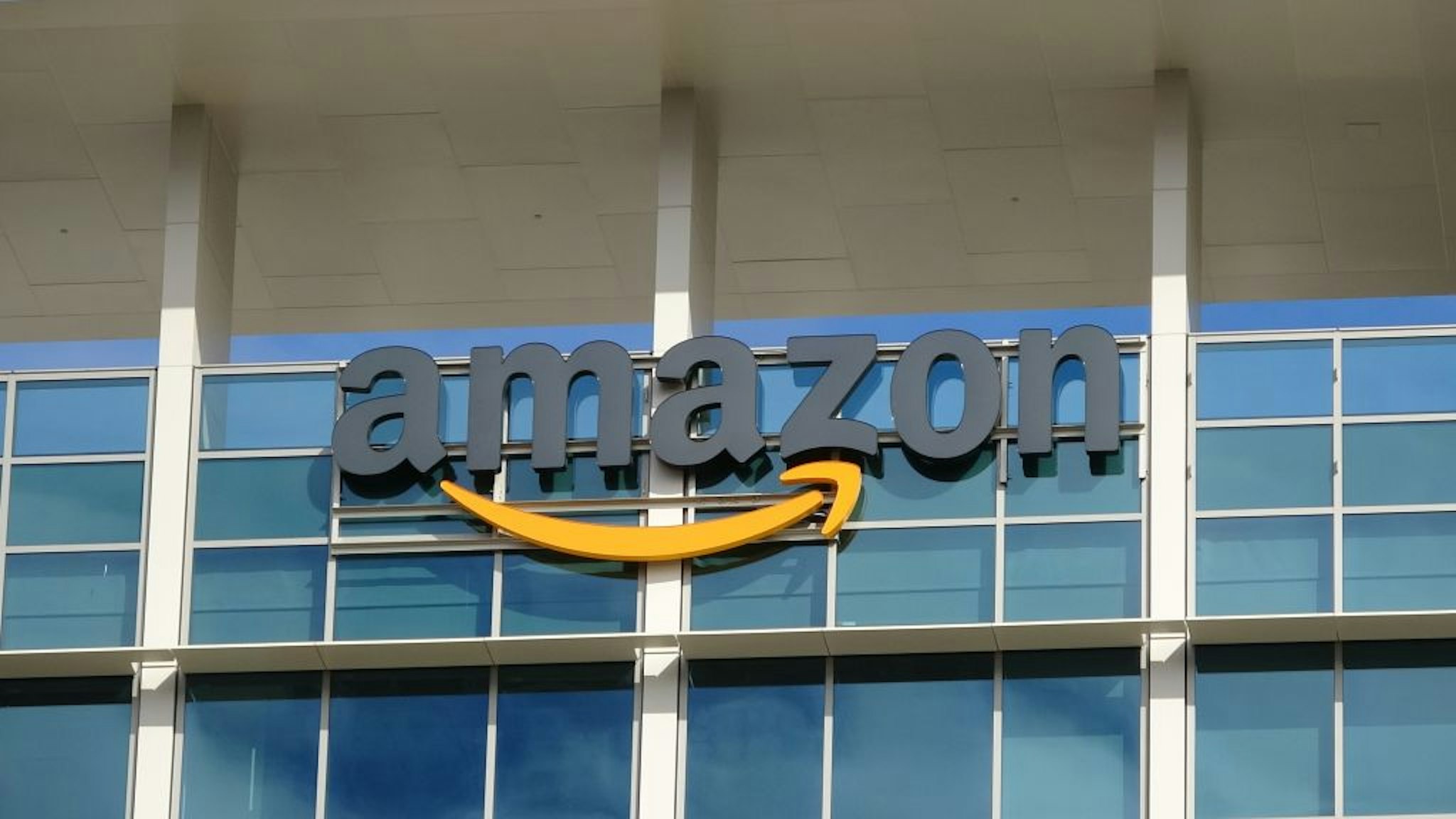 Close-up of sign with logo on facade of the regional headquarters of ecommerce company Amazon in the Silicon Valley town of Sunnyvale, California, October 28, 2018.