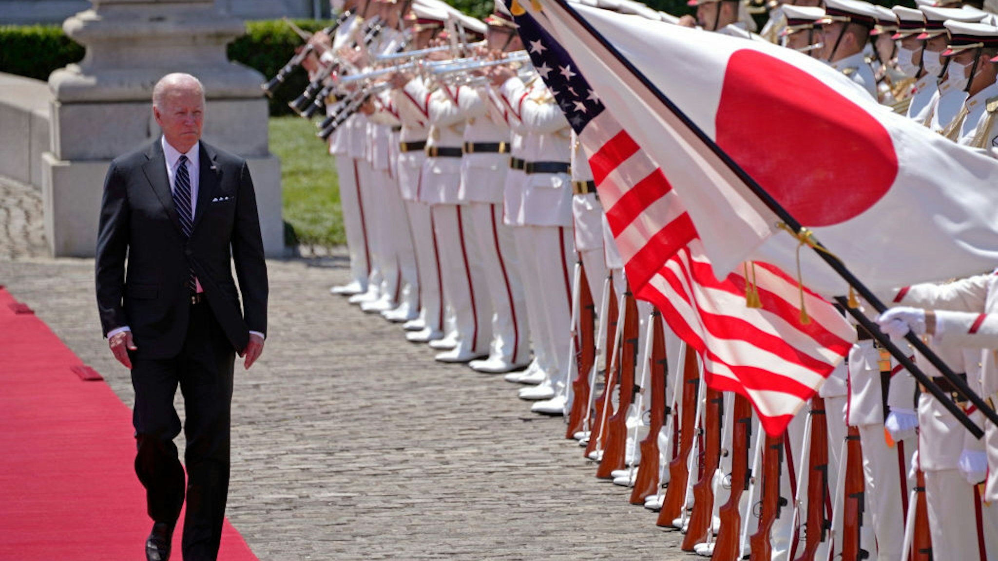 TOKYO, JAPAN - MAY 23: U.S. President Joe Biden reviews an honour guard during a welcome ceremony for Biden at the Akasaka State Guest House on May 23, 2022 in Tokyo, Japan. Biden arrived in Japan after his visit to South Korea, part of a tour of Asia aimed at reassuring allies in the region. Biden will also take part in the Quad Leaders' summit during his visit.