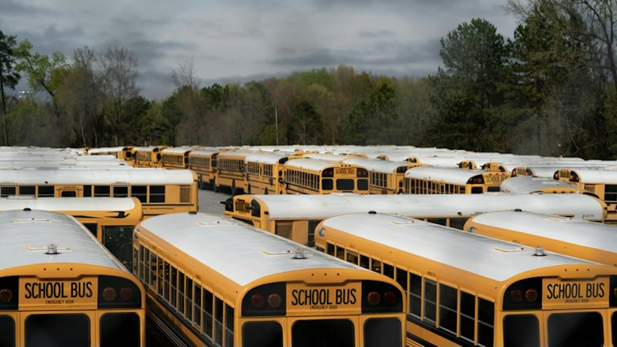 School Buses - stock photo School buses parked during Covid19 lockdown in Georgia, U.S. Photographer: Elijah Nouvelage/Bloomberg Bloomberg Creative via Getty Images