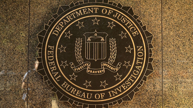 WASHINGTON, DC - MAY 09: The seal of the Federal Bureau of Investigation hangs on the outside of the bureau's Edgar J. Hoover Building May 9, 2017 in Washington, DC. On the recommendation of U.S. Attorney General Jeff Sessions, President Donald Trump fired FBI Director James Comey Tuesday. (Photo by Chip Somodevilla/Getty Images)