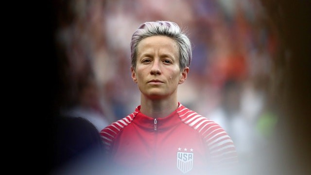 PARIS, FRANCE - JUNE 28: Megan Rapinoe of the USA looks on during the national anthem prior to the 2019 FIFA Women's World Cup France Quarter Final match between France and USA at Parc des Princes on June 28, 2019 in Paris, France. (Photo by Marianna Massey - FIFA/FIFA via Getty Images)