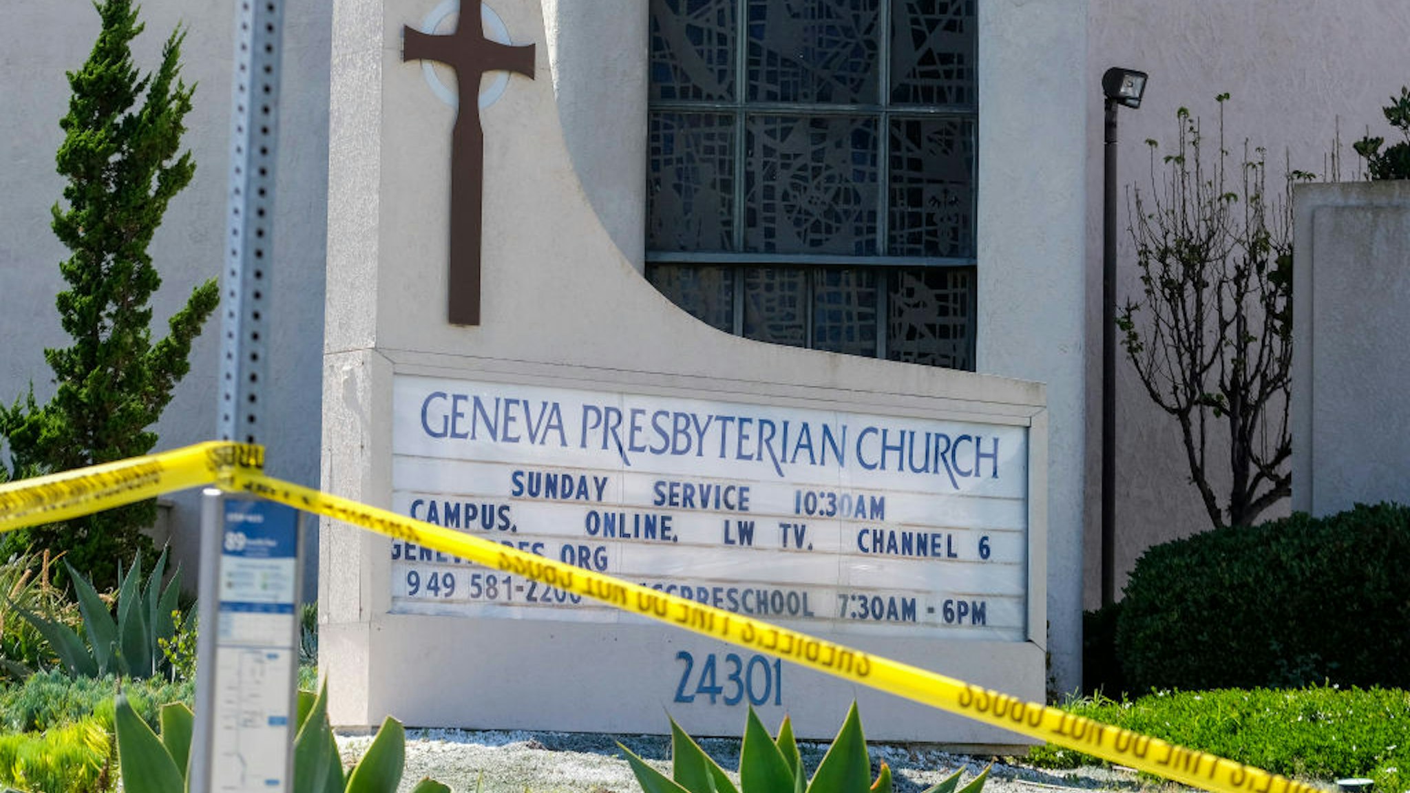 A police yellow tape is seen after a shooting inside Geneva Presbyterian Church in Laguna Woods, California, on May 15, 2022. - One person was dead and four people were "critically" injured in a shooting at a church near Los Angeles, law enforcement said Sunday