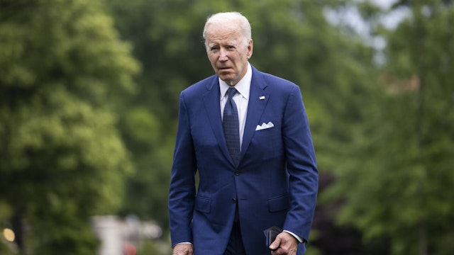 US President Joe Biden walks on the South Lawn of the White House after arriving on Marine One in Washington, D.C., US, on Tuesday, May 24, 2022. Biden is expected to speak this evening about the deadly elementary school shooting in Uvalde, Texas. Photographer: Jim Lo Scalzo/EPA/Bloomberg via Getty Images
