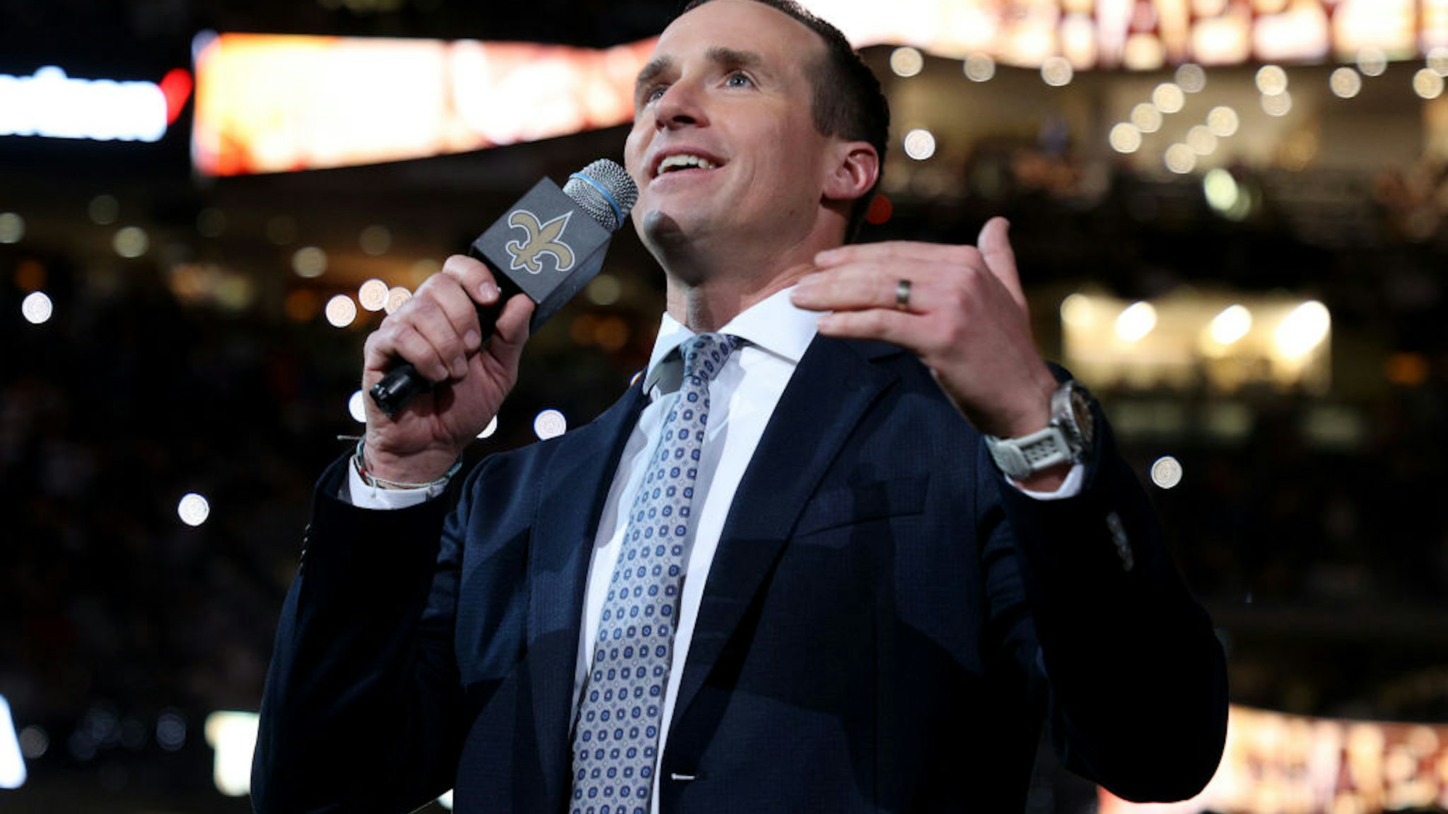 NEW ORLEANS, LOUISIANA - NOVEMBER 25: Former New Orleans Saints quarterback Drew Brees speaks to the fans during halftime of the game between the Buffalo Bills and the New Orleans Saints at Caesars Superdome on November 25, 2021 in New Orleans, Louisiana. (Photo by Chris Graythen/Getty Images)
