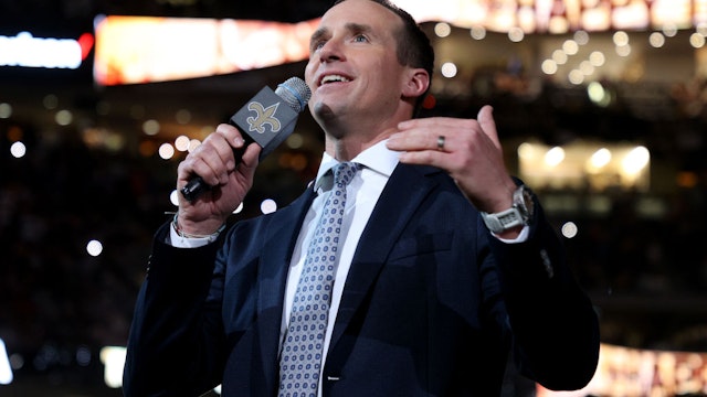 NEW ORLEANS, LOUISIANA - NOVEMBER 25: Former New Orleans Saints quarterback Drew Brees speaks to the fans during halftime of the game between the Buffalo Bills and the New Orleans Saints at Caesars Superdome on November 25, 2021 in New Orleans, Louisiana. (Photo by Chris Graythen/Getty Images)