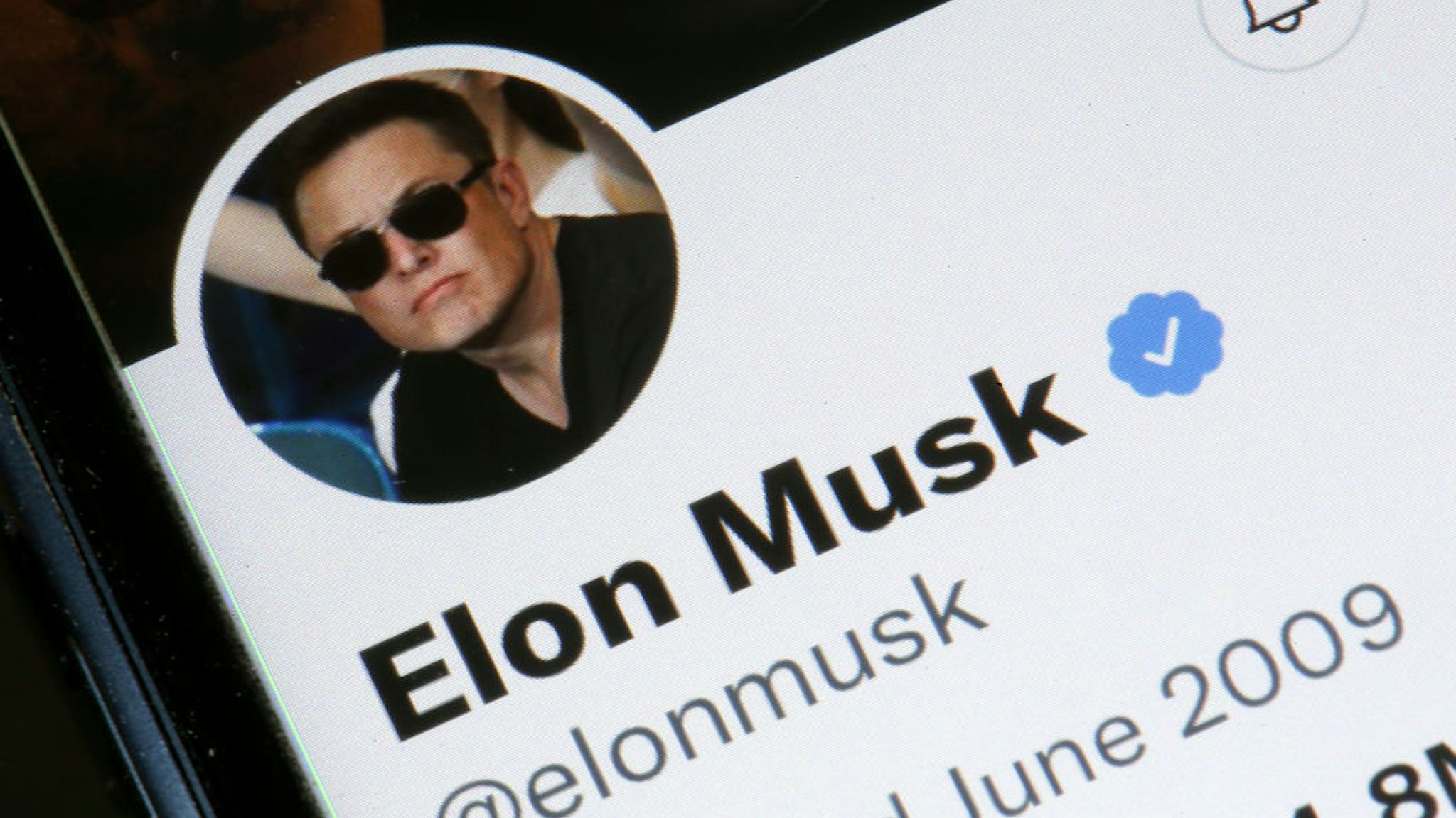 PARIS, FRANCE - APRIL 26: In this photo illustration, the Elon Musk’s Twitter account is displayed on the screen of an iPhone on April 26, 2022 in Paris, France. The U.S. multi-billionaire Elon Musk bought the social network Twitter on Monday April 25 for the sum of 44 billion dollars after two weeks of arm wrestling with the company's board of directors. (Photo illustration by Chesnot/Getty Images)