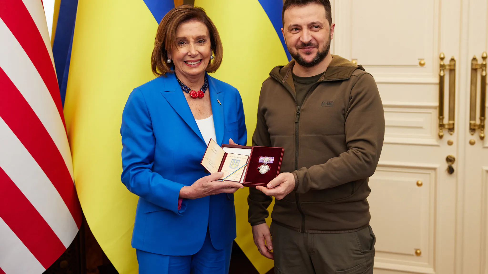 Nancy Pelosi Meets In Kyiv With Ukrainian President Zelensky KYIV, UKRAINE - APRIL 30: Ukrainian President Volodymyr Zelensky presents the Order of Princess Olga, a Ukrainian civil decoration, to U.S. Speaker of the House Nancy Pelosi during a visit by a U.S. congressional delegation on April 30, 2022 in Kyiv, Ukraine. The US Speaker of the House led a congressional delegation, which on a secret meeting with the Ukrainian president that was announced the next day, as they left the country for nearby Poland.