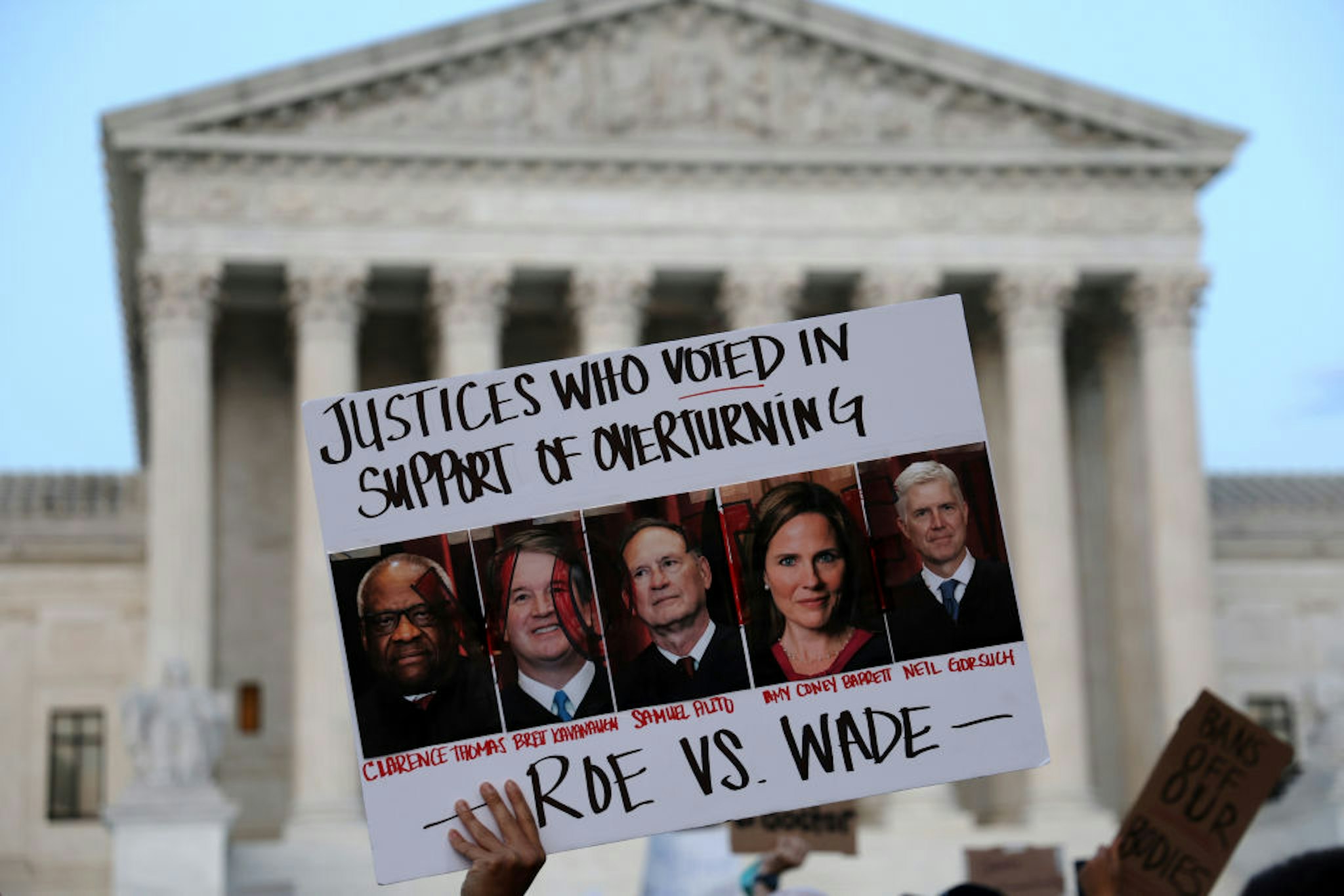 WASHINGTON, DC - MAY 03: A pro-choice activist holds up a sign during a rally in front of the U.S. Supreme Court in response to the leaked Supreme Court draft decision to overturn Roe v. Wade May 3, 2022 in Washington, DC. In a leaked initial draft majority opinion obtained by Politico and authenticated by Chief Justice John Roberts, Supreme Court Justice Samuel Alito wrote that the cases Roe v. Wade and Planned Parenthood of Southeastern Pennsylvania v. Casey should be overturned, which would end federal protection of abortion rights across the country.