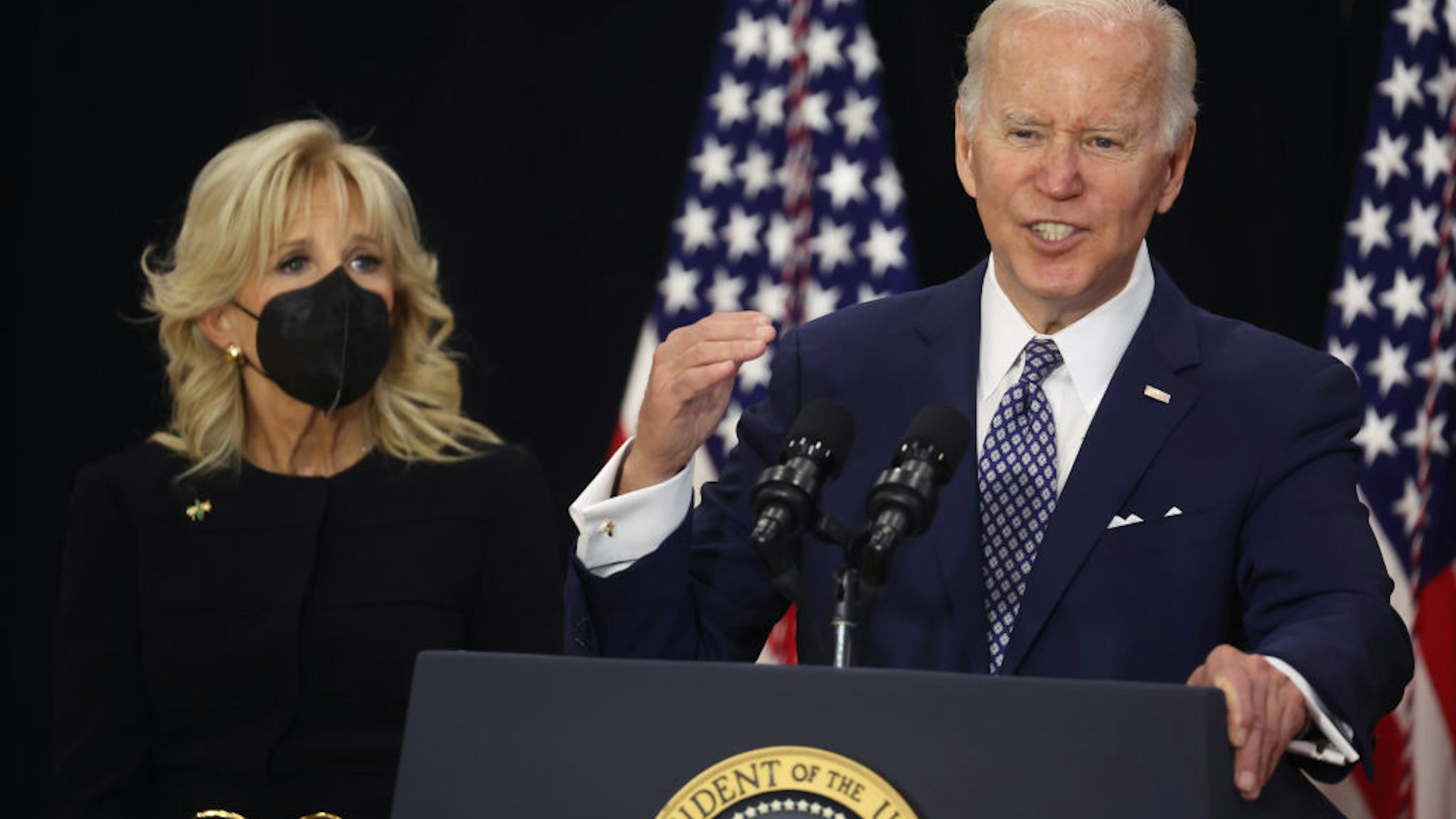 BUFFALO, NEW YORK - MAY 17: With his wife Jill by his side, US President Joe Biden delivers remarks to guests, most of whom lost a family member in the Tops market shooting, at the Delavan Grider Community Center on May 17, 2022 in Buffalo, New York. The president and first lady placed flowers at a memorial outside of the Tops market and met with families of victims prior to addressing the guests at the community center. A gunman opened fire at the Tops market on Saturday killing ten people and wounding another three. The attack was believed to be motivated by racial hatred. (Photo by Scott Olson/Getty Images)