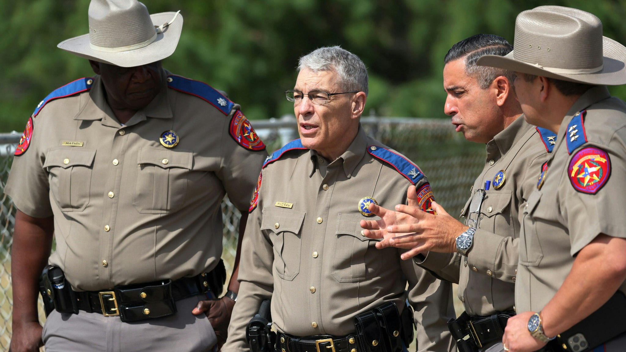 UVALDE, TEXAS - MAY 30: Steven C. McCraw, Director and Colonel of the Texas Department of Public Safety (2nd L), speaks with DPS State Troopers near Robb Elementary School on May 30, 2022 in Uvalde, Texas. Visitations for Amerie Jo Garza and Maite Rodriguez, two of the 19 children killed in the May 24th Robb Elementary School mass shooting are being held today. Wakes and funerals for the 21 victims will be scheduled throughout the week.
