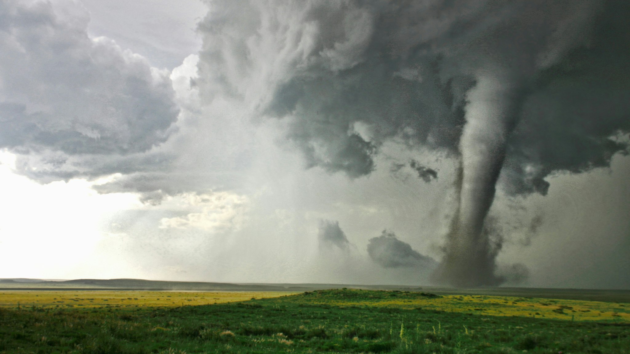 Tornado column in rural landscape - stock photo