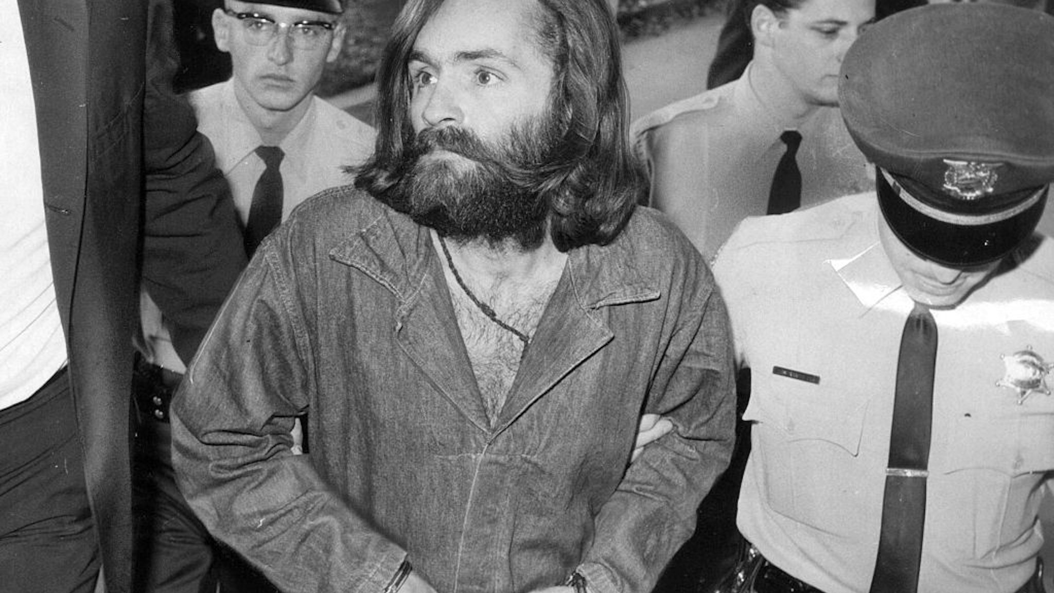 Charles Manson is escorted to court for preliminary hearing on December 3, 1969 in Los Angeles, California.