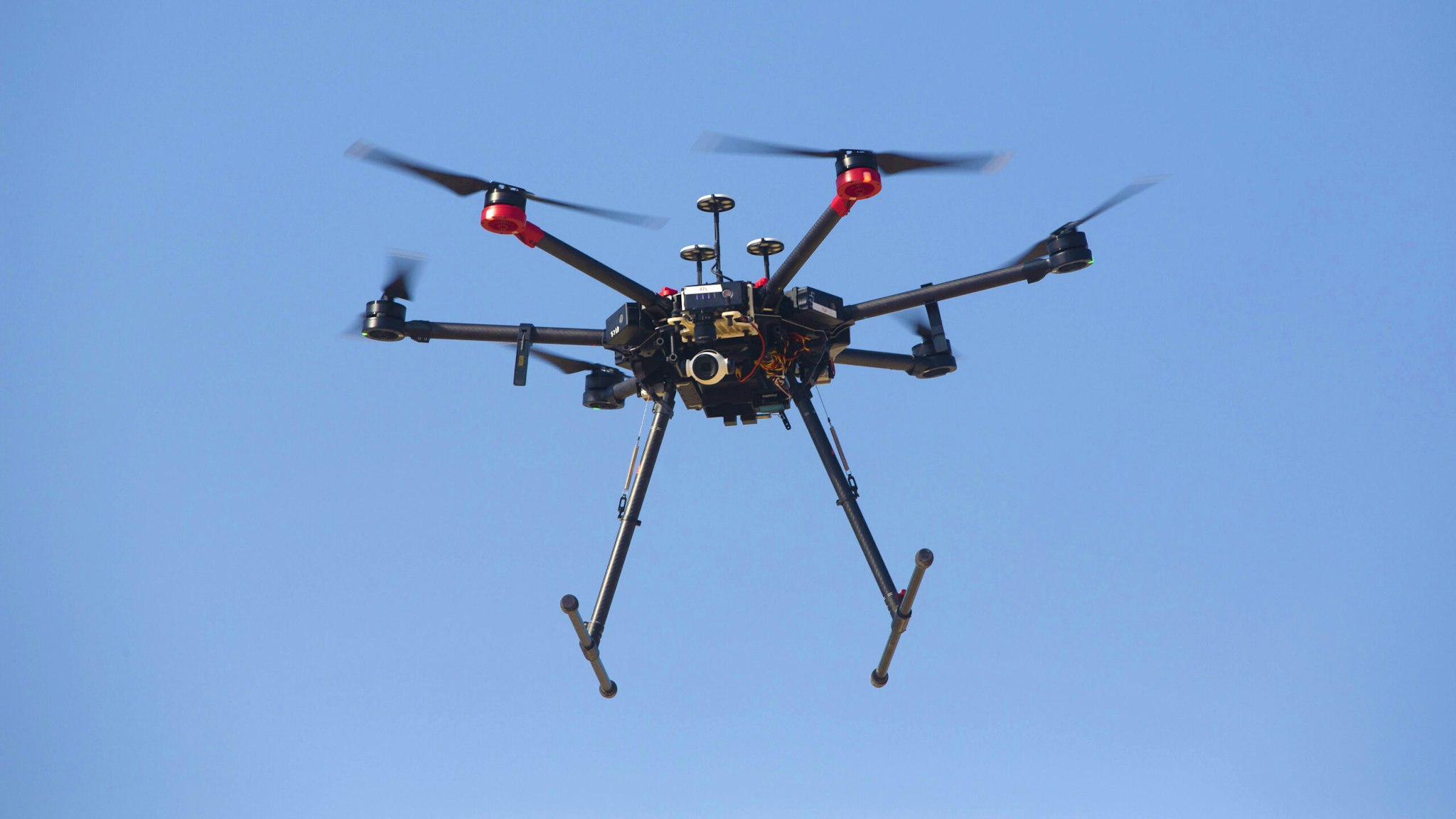 An Israeli DJI Matrice 600 Pro military drone used for bringing down incendiary balloons and kites flown from Gaza flies during a media demonstration by the Israeli Defense Force (IDF) at an army base near Rishon LeZion, Israel, on Tuesday, Nov. 26, 2019. Drones are a new and significant threat, Israeli Prime Minister Benjamin Netanyahu told the Cabinet Sunday, adding that the army intercepted one launched from the Gaza Strip over the weekend.