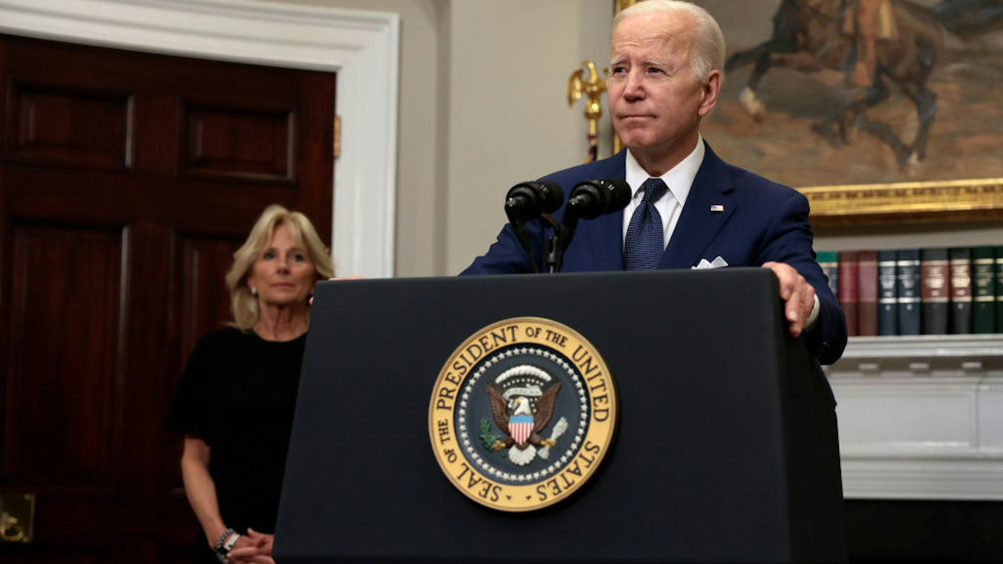 WASHINGTON, DC - MAY 24: U.S. President Joe Biden delivers remarks from the Roosevelt Room of the White House as first lady Jill Biden looks on concerning the mass shooting at a Texas elementary school on May 24, 2022 in Washington, DC. Eighteen people are dead after a gunman today opened fire at the Robb Elementary School in Uvalde, Texas, according to published reports. (Photo by Anna Moneymaker/Getty Images)